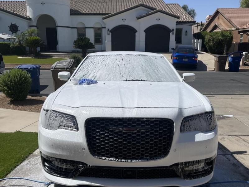 Chrysler 300 covered in thick foam during a hand wash