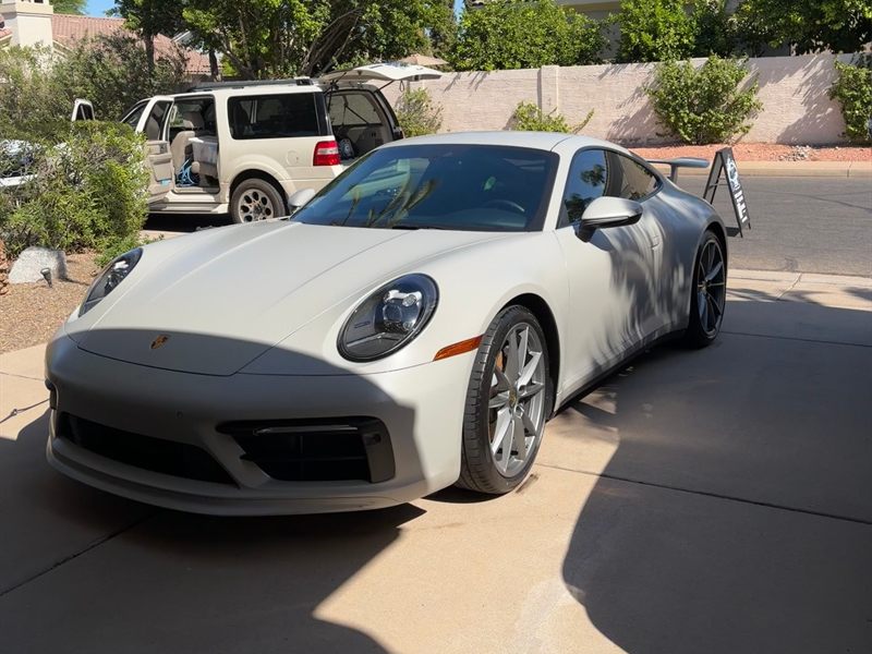 Chalk white Porsche 911 Carrera with a flawless paint finish after a mobile detail in Queen Creek, Arizona